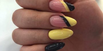 Manucure jaune et noire à la mode